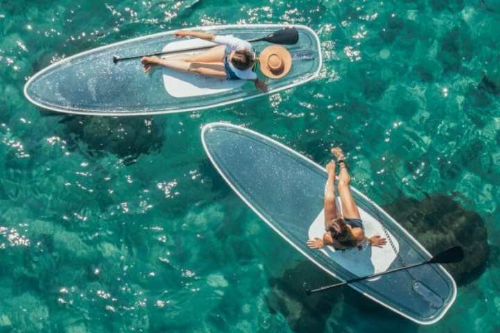 a person riding a surf board on a body of water