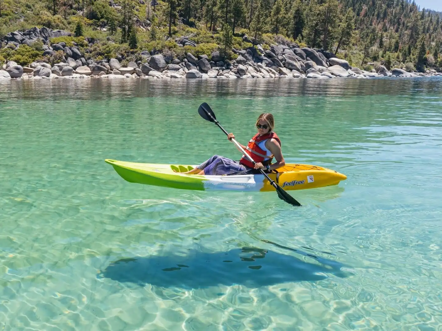 a person riding a surf board on a body of water