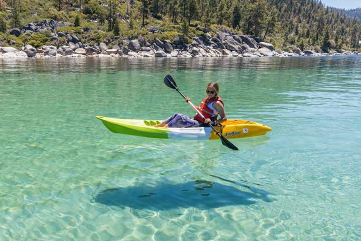 a person riding a surf board on a body of water