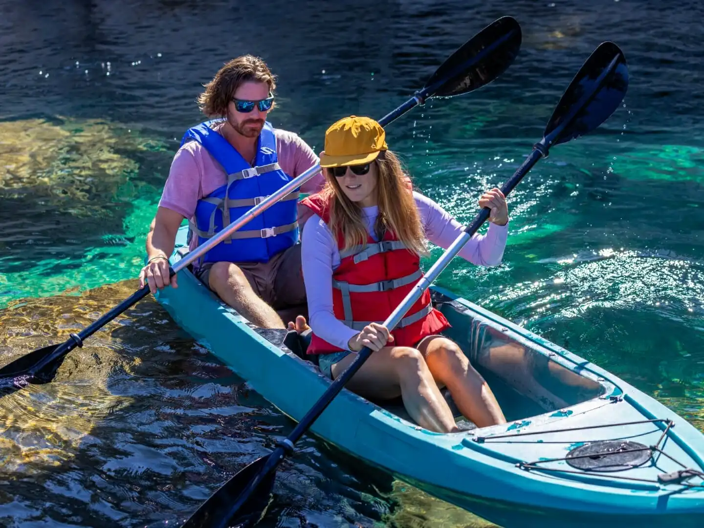 a person riding on the back of a boat in the water