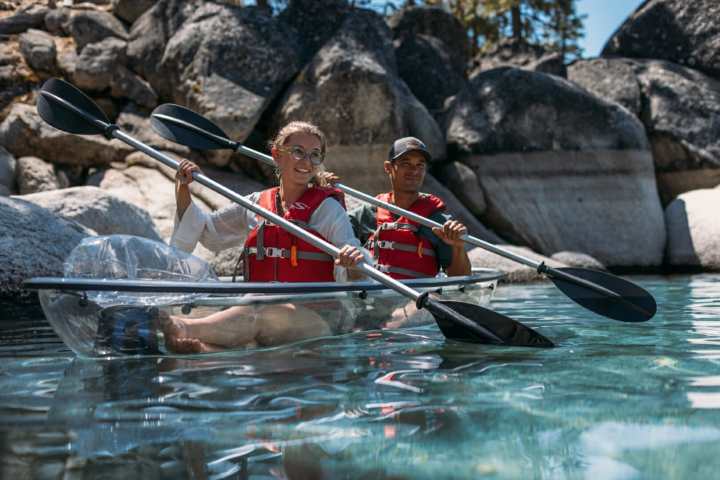 a man riding on the back of a boat
