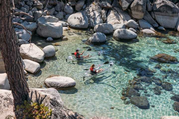 a close up of a rock near the ocean