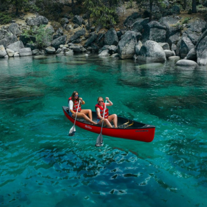 a group of people in a pool of water